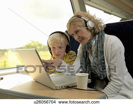 Grandmother and grandson on train View Large Photo Image Picture - Grandmother and grandson on train. Fotosearch