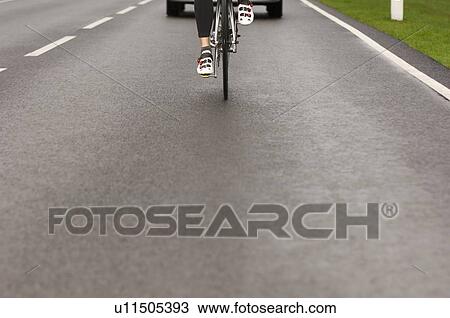 Man cycling in park View Large Photo Image Stock Image - Man cycling in park. Fotosearch