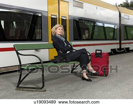 Mature woman on train station View Large Photo Image Stock Photo - Mature woman on train station. Fotosearch