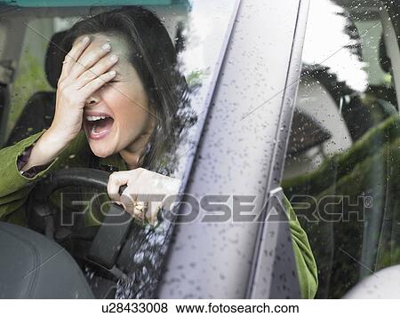 Stock Photo - Restive woman driving. Fotosearch