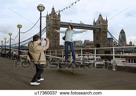 Tourists in front of Tower Bridge View Large Photo Image Stock Photo - Tourists in front of Tower Bridge. Fotosearch