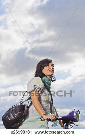 Woman on scooter. View Large Photo Image Stock Image - Woman on scooter.. Fotosearch