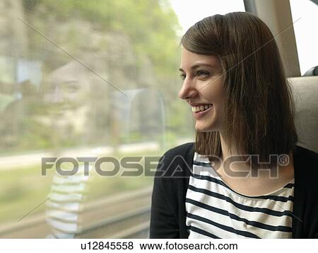 Woman on train View Large Photo Image Stock Photo - Woman on train. Fotosearch