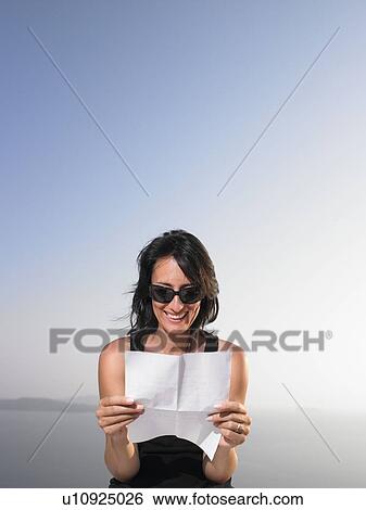Stock Photograph - Woman reading a letter. Fotosearch