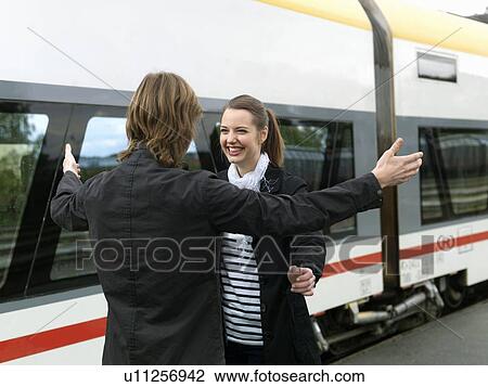 Young couple on train station View Large Photo Image Stock Image - Young couple on train station. Fotosearch