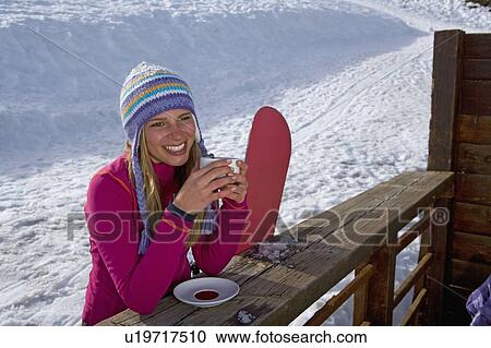 Girl holding cup, smiling View Large Photo Image Stock Image - Girl holding cup, smiling. Fotosearch