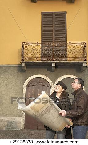 Mature couple with architectural plans View Large Photo Image Stock Photo - Mature couple with architectural plans. Fotosearch