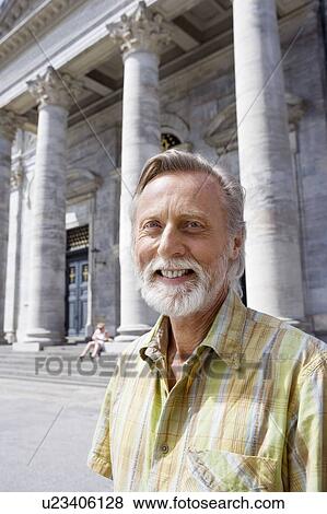 Portrait of man in front of church View Large Photo Image Stock Photo - Portrait of man in front of church. Fotosearch