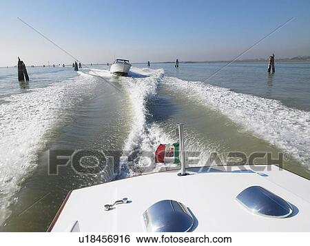 Rear view of water lane seen from back of boat. View Large Photo Image Stock Photograph - Rear view of water lane seen from back of boat.. Fotosearch