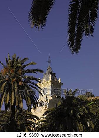 Spain, Andalusia, Malaga, town hall clock tower and palm trees, high section View Large Photo Image Stock Image - Spain, Andalusia, Malaga, town hall clock tower and palm trees, high section. Fotosearch