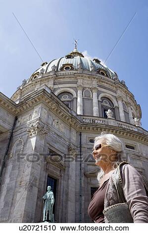 Woman in front of church View Large Photo Image Stock Image - Woman in front of church. Fotosearch