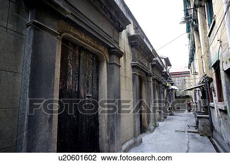 Stock Image - China, Shanghai, an alley passing the gate of private residence. Fotosearch
