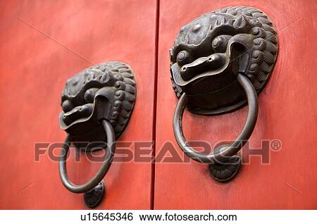 Stock Photograph - China, Shanghai, close up of door knocker. Fotosearch