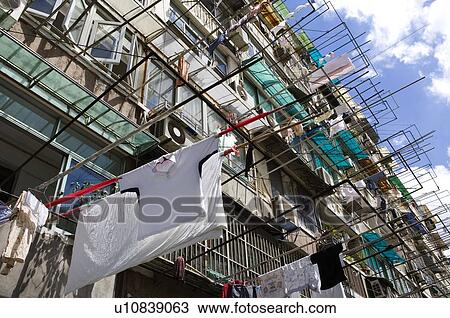 China, Shanghai, laundry hanging outside flat View Large Photo Image Stock Image - China, Shanghai, laundry hanging outside flat. Fotosearch