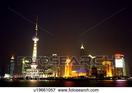 Stock Photo - China, Shanghai, Oriental Pearl Tower and Pudong Skyline at night. Fotosearch