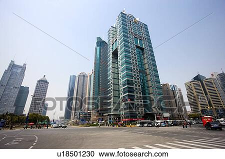 Stock Image - China, Shanghai, skyscrapers and street. Fotosearch
