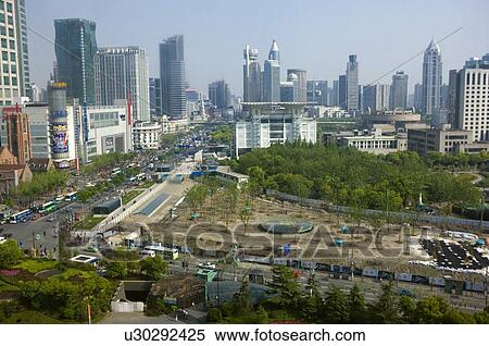 High-rise buildings behind a park landscape in Shanghai, China View Large Photo Image Stock Photography - High-rise buildings behind a park landscape in Shanghai, China. Fotosearch