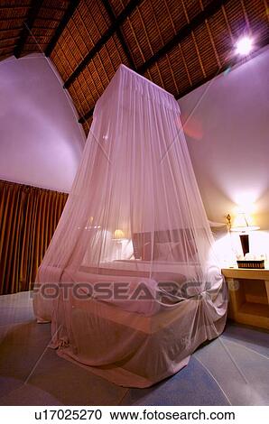 A romantic bedroom with curtain around bed View Large Photo Image Stock Image - A romantic bedroom with curtain around bed. Fotosearch