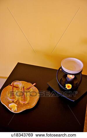 Cups, flower, candle on the desk View Large Photo Image Stock Photo - Cups, flower, candle on the desk. Fotosearch