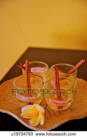 Cups with frangipani on plate View Large Photo Image Stock Image - Cups with frangipani on plate. Fotosearch