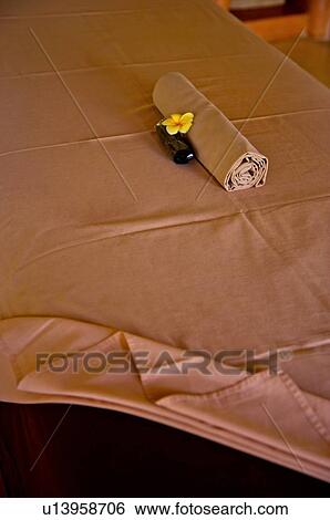 Rolled towel on the massage table View Large Photo Image Stock Photograph - Rolled towel on the massage table. Fotosearch