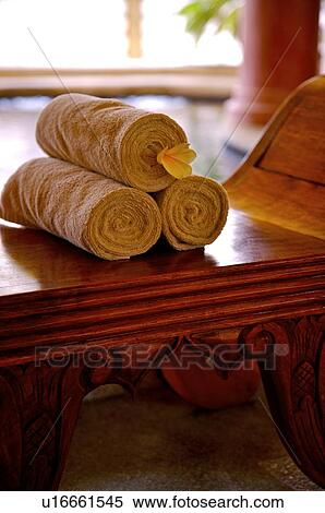 Rolled towel with flower on the desk View Large Photo Image Stock Photography - Rolled towel with flower on the desk. Fotosearch