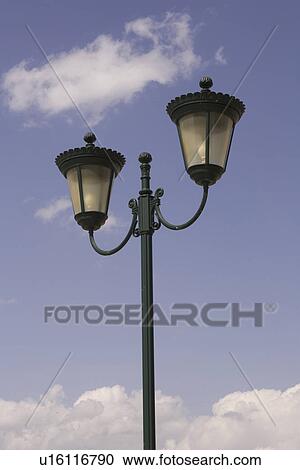 Stock Image - Blue, Close-Up, Cloud, Day, Lamppost. Fotosearch