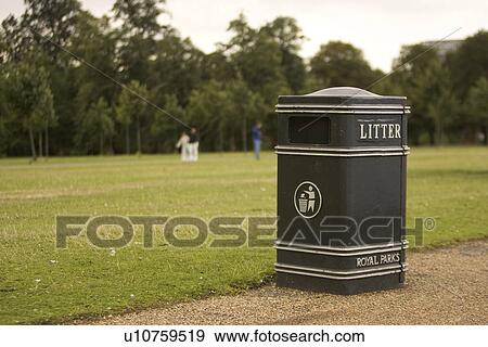 Stock Photo - Day, Focus On Foreground, Garbage Bin, Grass, Grass Family. Fotosearch