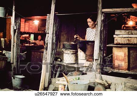 Stock Photo - A cooking woman in Showa. Fotosearch