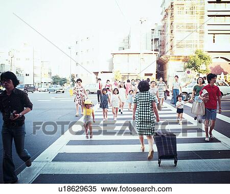 Stock Photography - Pedestrians Crossing a zebra zone. Fotosearch