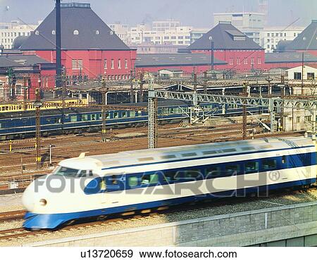 Stock Photo - Shinkansen and Tokyo station. Fotosearch