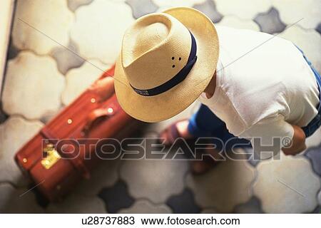 A Man Picking Up Suitcase, High Angle View, Differential Focus View Large Photo Image Stock Image - A Man Picking Up Suitcase, High Angle View, Differential Focus. Fotosearch