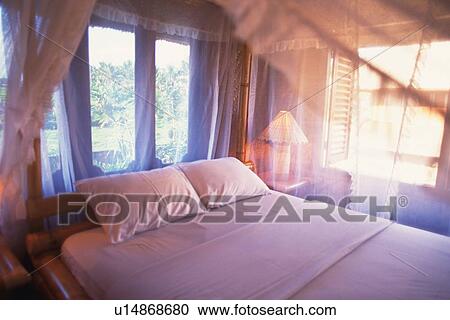 Stock Image - Bed in Room of Resort Hotel, High Angle View . Fotosearch
