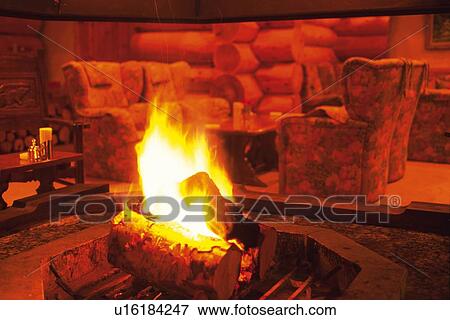 Stock Photo - Fireplace in Living Room, Toned Image. Fotosearch