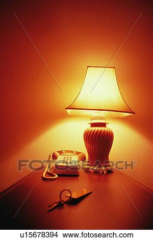 Light Stand, Room Key and Telephone on Desk View Large Photo Image Picture - Light Stand, Room Key and Telephone on Desk. Fotosearch