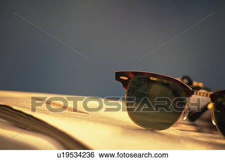 Sunglass on Magazine, Close Up, Differential Focus View Large Photo Image Stock Photograph - Sunglass on Magazine, Close Up, Differential Focus. Fotosearch