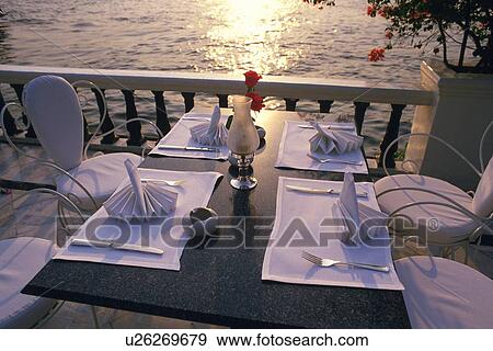 Stock Photo - Table Set by the Sea, High Angle View. Fotosearch