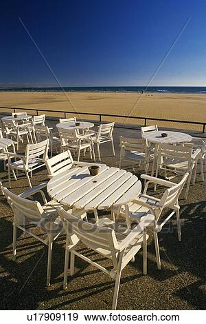 Stock Photo - White Table and Chair by the Sea, High Angle View. Fotosearch