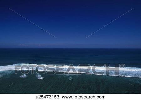 Stock Image - Blue Sky and the Ocean, High Angle View. Fotosearch