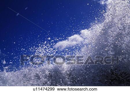 Stock Photo - Closed Up Image of the Ocean Surf, Low Angle View. Fotosearch