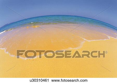 Stock Image - Gentle Waves of the Tropical Beach, Pan focus. Fotosearch