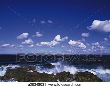The Blue sky and the Waves Breaking on the Shore View Large Photo Image Stock Image - The Blue sky and the Waves Breaking on the Shore . Fotosearch
