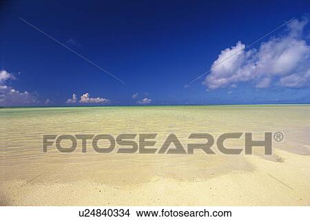 Tropical Beach and Clouds Sailing in the Blue Sky, Pan Focus View Large Photo Image Picture - Tropical Beach and Clouds Sailing in the Blue Sky, Pan Focus. Fotosearch