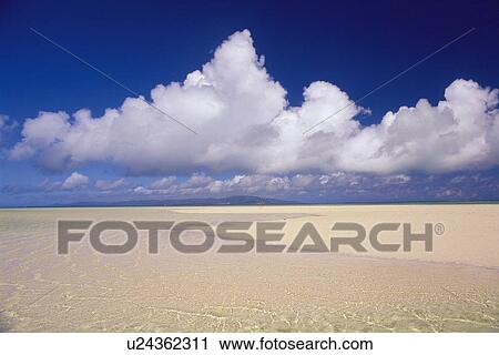 Tropical Beach and the Clouds Sailing in the Blue Sky, Pan Focus View Large Photo Image Stock Image - Tropical Beach and the Clouds Sailing in the Blue Sky, Pan Focus. Fotosearch