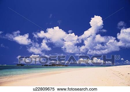 Tropical Beach and the Clouds Sailing in the Blue Sky, Pan Focus View Large Photo Image Stock Photography - Tropical Beach and the Clouds Sailing in the Blue Sky, Pan Focus. Fotosearch