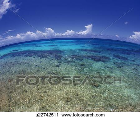 Stock Image - Tropical Ocean and the Blue Sky, Pan Focus, Fish-eye. Fotosearch