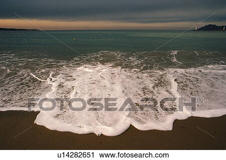 Waves Lapping at the Beach, Pan Focus View Large Photo Image Stock Image - Waves Lapping at the Beach, Pan Focus. Fotosearch