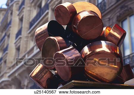 Stock Photo - Closed Up Image of Several Bronze Pots Next to an Apartment House, Low Angle View, Differential Focus, In Focus, Out Focus, Paris, France. Fotosearch