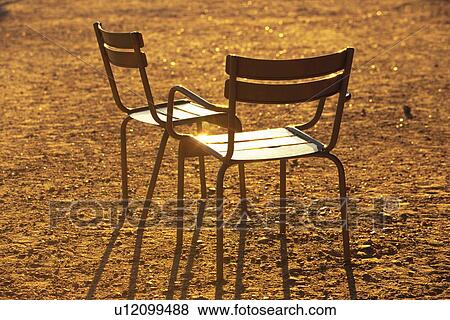 Stock Photo - Closed Up Image of Two Chairs Standing on a Brown-colored Ground, High Angle View, Paris, France. Fotosearch