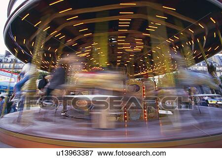 Image of a Carousel in Motion, Front View, Blurred Motion, Long Exposure, Paris, France View Large Photo Image Stock Photo - Image of a Carousel in Motion, Front View, Blurred Motion, Long Exposure, Paris, France. Fotosearch